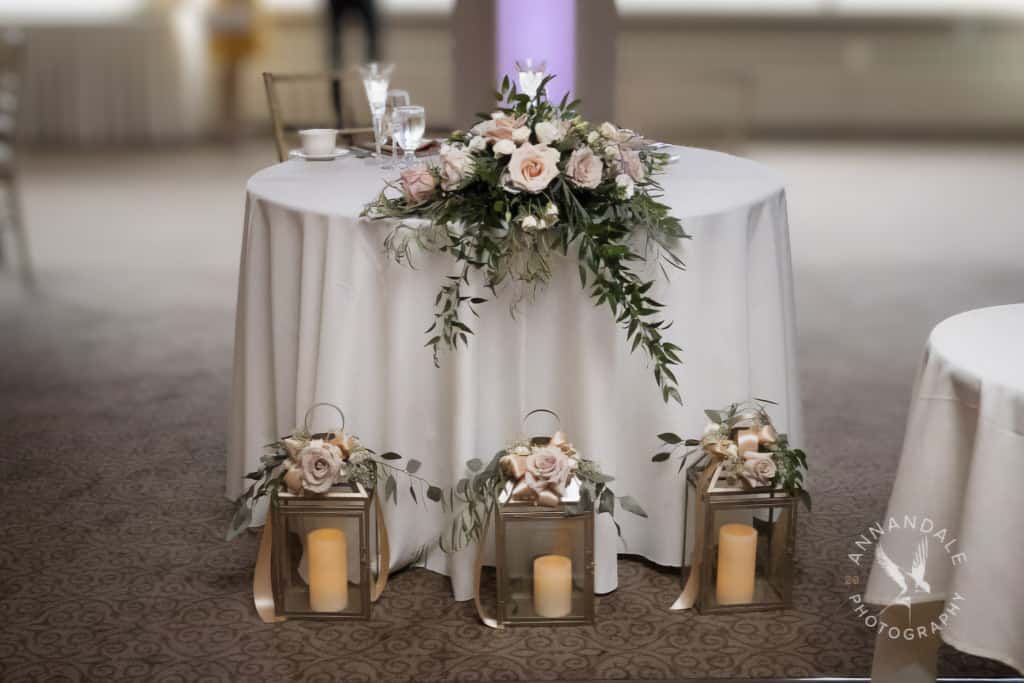 Sweetheart table with three lanterns